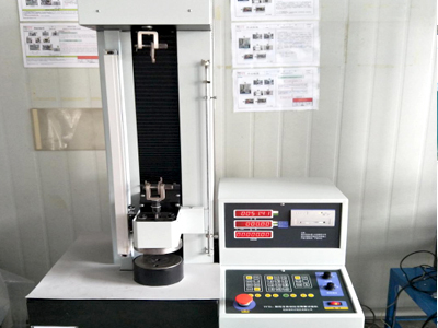 Tensile and compression testing machine